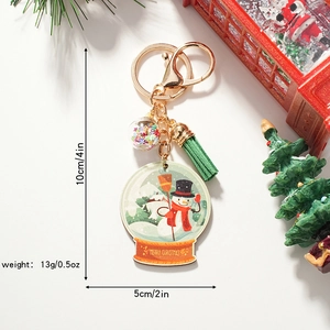 Christmas Snow Globe Keychain with snowman, green tassel and golden metal carabiner link