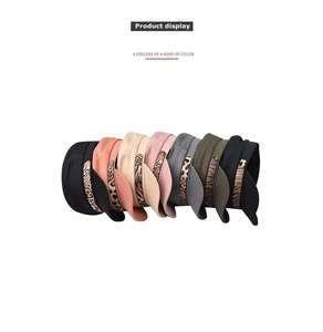 Flat lay display of military style berets in seven colors with leopard print chain bands