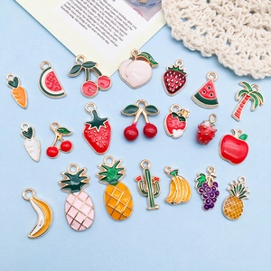 Macro shot of assorted colorful fruit and vegetable alloy charms with enamel finish
