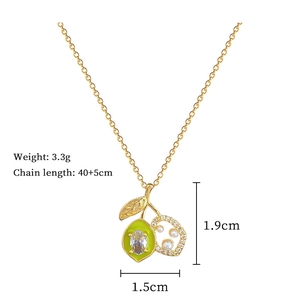 Detailed specs of lemon pendant necklace with green enamel, zircons, and pearls