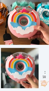 Detail view of pink donut water bottle for kids with rainbow design and carry strap