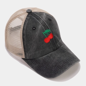 Side view of mesh baseball cap featuring detailed red cherry embroidery and washed cotton fabric