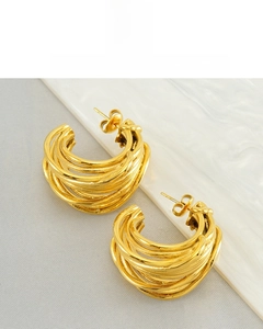 Detail of multi-layer C-shaped 18K gold vacuum plated earrings with non-tarnish finish