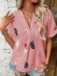 Detail of pink feather print shirt featuring a V-neck and rolled short sleeves