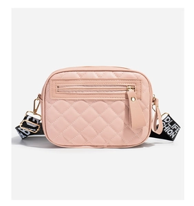 Pink quilted leather crossbody camera bag with adjustable geometric patterned wide strap