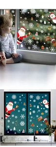 Close-up of double-sided Christmas window clings featuring Santa, snowman and reindeer