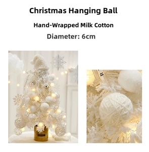 Detail of 6cm handmade white yarn Christmas ball with woven texture on a white tree