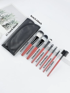 Detailed view of 8pcs travel makeup brush set with red wood handles and black leather case