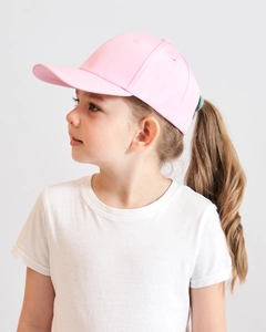 Close-up of children's pink ponytail baseball cap showing side profile and breathable fabric