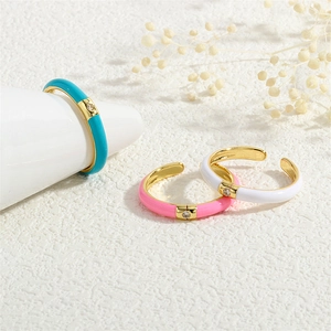 Macro shot of 18K gold plated enamel rings with colorful inlay and micro zircon stones