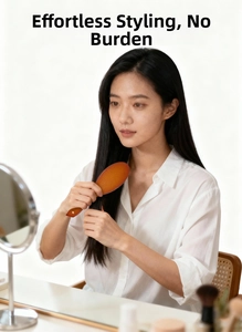 Brown wood texture boar bristle brush used by a woman for smooth long hair care