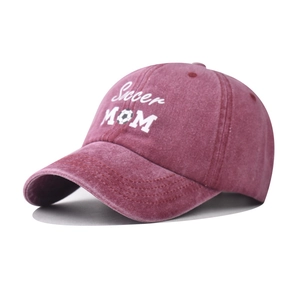 Detail of washed red Soccer MOM baseball cap with white embroidery and football logo