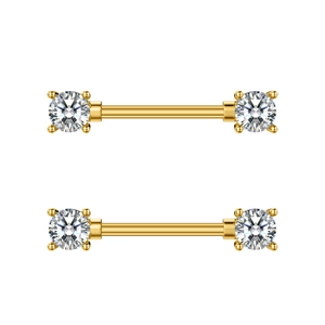 Detailed close-up of golden nipple rings with sparkling clear cubic zirconia stones