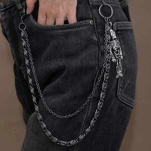 Detail of gun black double-layer punk waist chain with hanging metal skull pendant