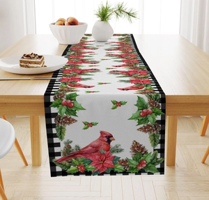 Detail of Christmas table runner with winter cardinals, pinecones and plaid borders