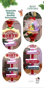 Illuminated Christmas road sign decor with glowing Santa globe and North Pole markers