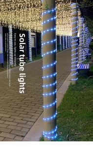 Close-up of blue LED rope lights wrapped on a post for waterproof outdoor garden decor