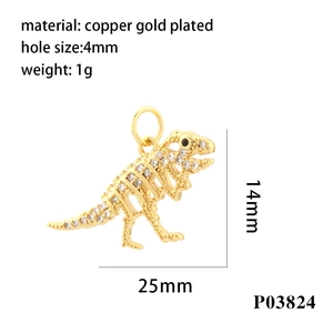 Macro shot of 18K gold plated copper dinosaur skeleton pendant with cubic zirconia