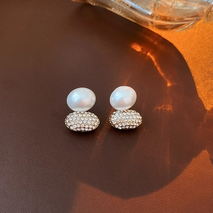 Elegant gold-plated flower stud earrings with white pearl and sparkling crystals detail