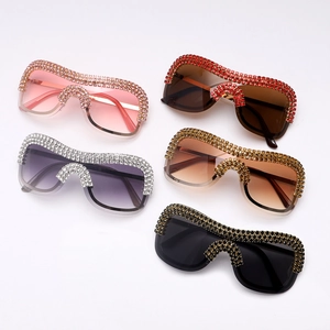 Detail showing five colors of oversized punk sunglasses with luxury rhinestone crystals