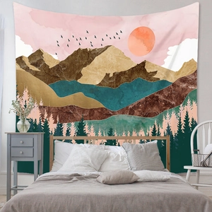 Artistic landscape tapestry with mountains and forest decor hanging above a bed