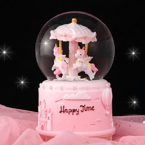 Pink carousel music box snow globe with unicorns and a castle base for Christmas gifts