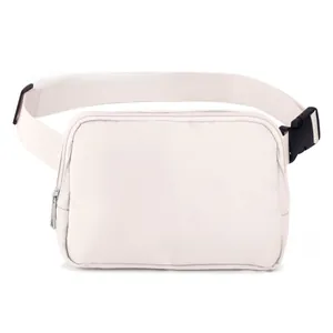 Detail of adjustable woven strap and black plastic buckle on off-white belt bag