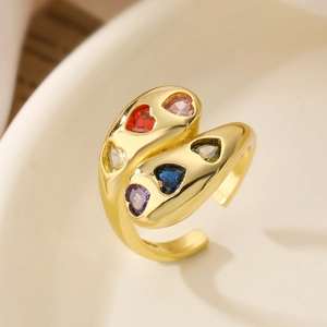 Detailed shot of gold plated open ring with multi-color heart-shaped cubic zirconia stones
