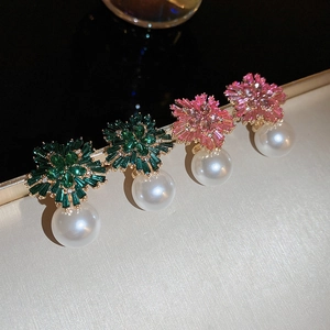 Close-up of luxury flower earrings with sparkling crystals and large white pearls