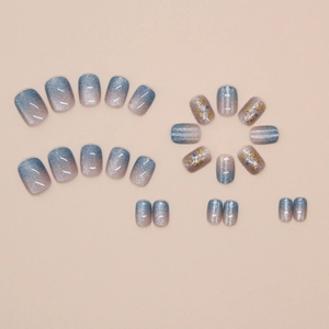 Blue and pink gradient press-on nails with silver glitter and gold foil accents