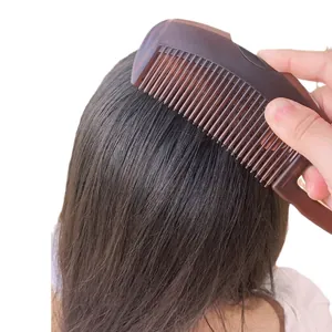 Amber texture scalp massage comb for hair care and meridian dredging in hand