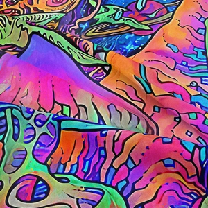 Detail of bohemian mushroom tapestry showing vibrant psychedelic print and soft fabric texture