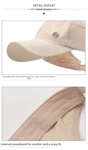 Detail of beige sun hat featuring extended brim, inner sweatband and metal logo