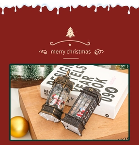 Close-up of vintage bronze Christmas lanterns with Santa Claus and glitter snow details