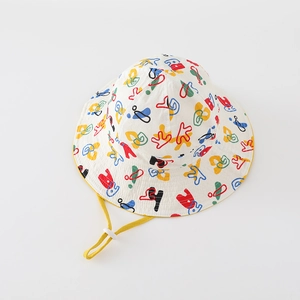 Detail of colorful graffiti print on kids bucket hat with yellow adjustable strap