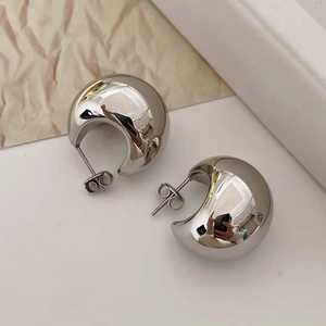 Polished silver C-shaped teardrop earrings in high-shine minimalist metal design