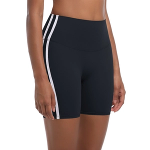 Detailed side view of high-waisted black yoga shorts with white double stripes