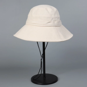 Beige cotton linen sun hat with wide brim and adjustable windproof rope for summer use