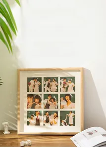 Detail of light wood 9-opening sudoku picture frame with white mat for wall and tabletop