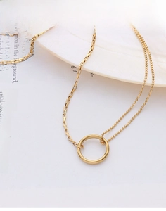 Detail of 18k gold double chain necklace featuring bead and box links with a ring pendant