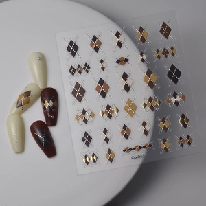 Retro brown diamond pattern nail stickers with gold accents and warm Maillard tones