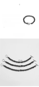 Detail of double-layer titanium steel bracelet with black and silver chains and OT buckle
