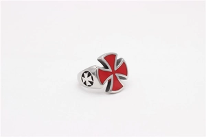 Macro shot of silver titanium steel ring featuring red Iron Cross and side engravings