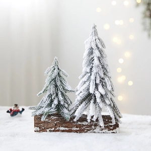Set of two mini snowy PE Christmas trees on natural wooden base for table decoration