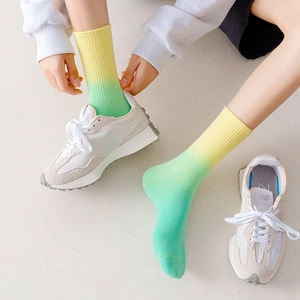 Unisex yellow and green gradient tie-dye crew socks with ribbed cuffs for sports