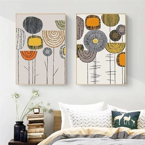 Modern Nordic abstract geometric leaf art prints with gold frames in bedroom setting