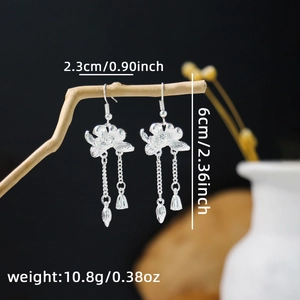 Detailed view of silver flower earrings with tassels and sizing measurements displayed