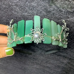 Handmade green crystal crown headband featuring sun charm and branch metal accents