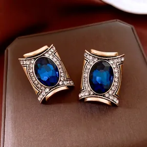 Vintage Baroque style oval blue crystal earrings with crystal border on jewelry box