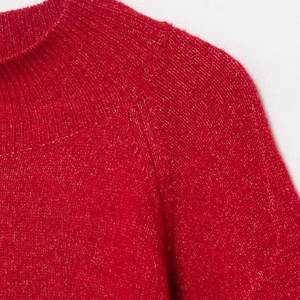 Women's red heathered knit sweater featuring a stylish ribbed crewneck and raglan sleeves